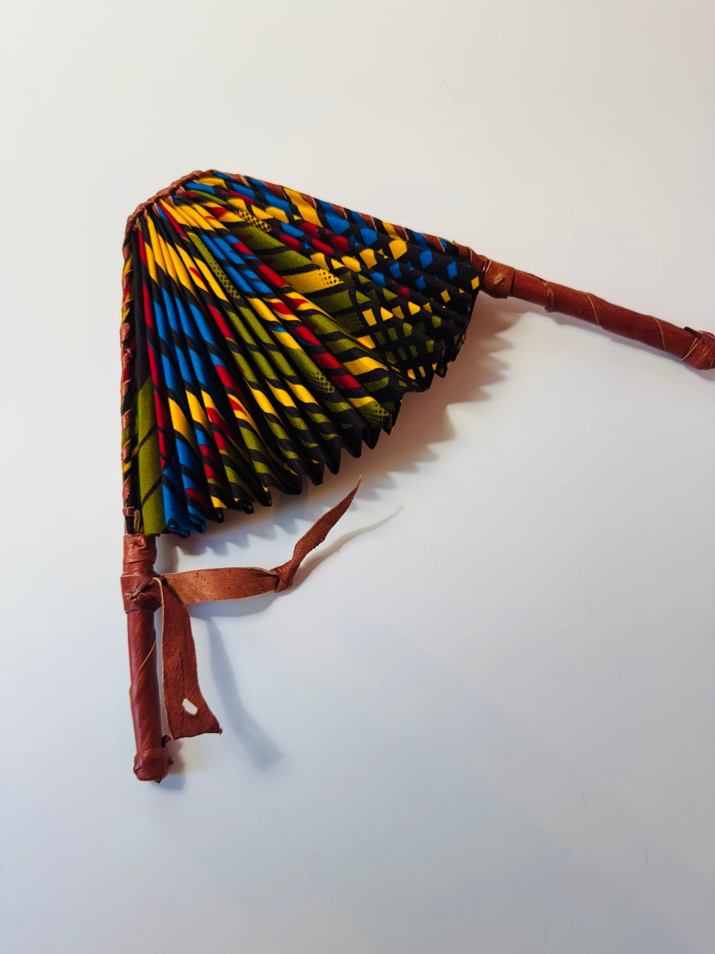Handcrafted African Ankara Folding Fan – Multicolor Spiral Pattern with Leather Handle