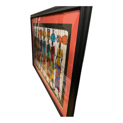 Framed art - a batik of colorful women